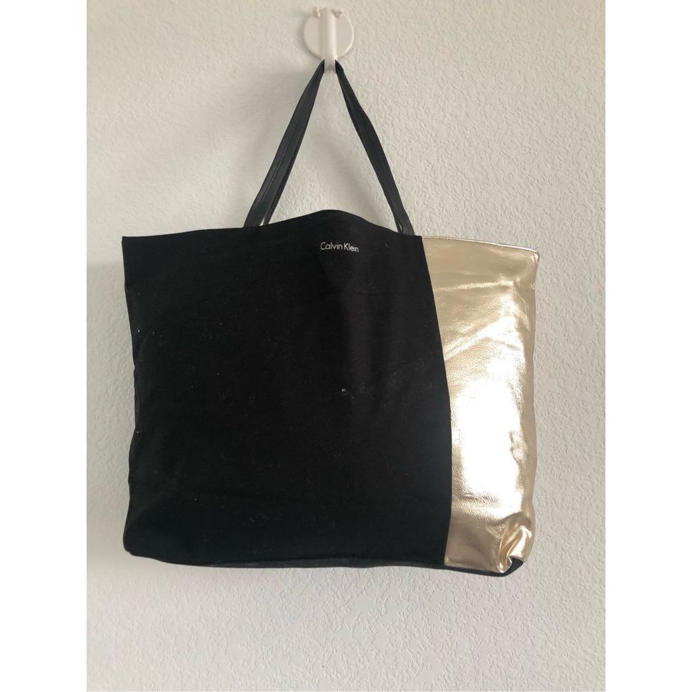 Calvin Klein black and gold canvas tote bag 15x12x4”